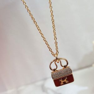 Hermès CONSTANCE RED PEDANT PINK GOLD NECKLACE