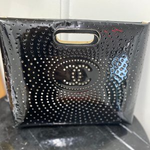 CHANEL CC PERFORATED PATENT CLUTCH BAG